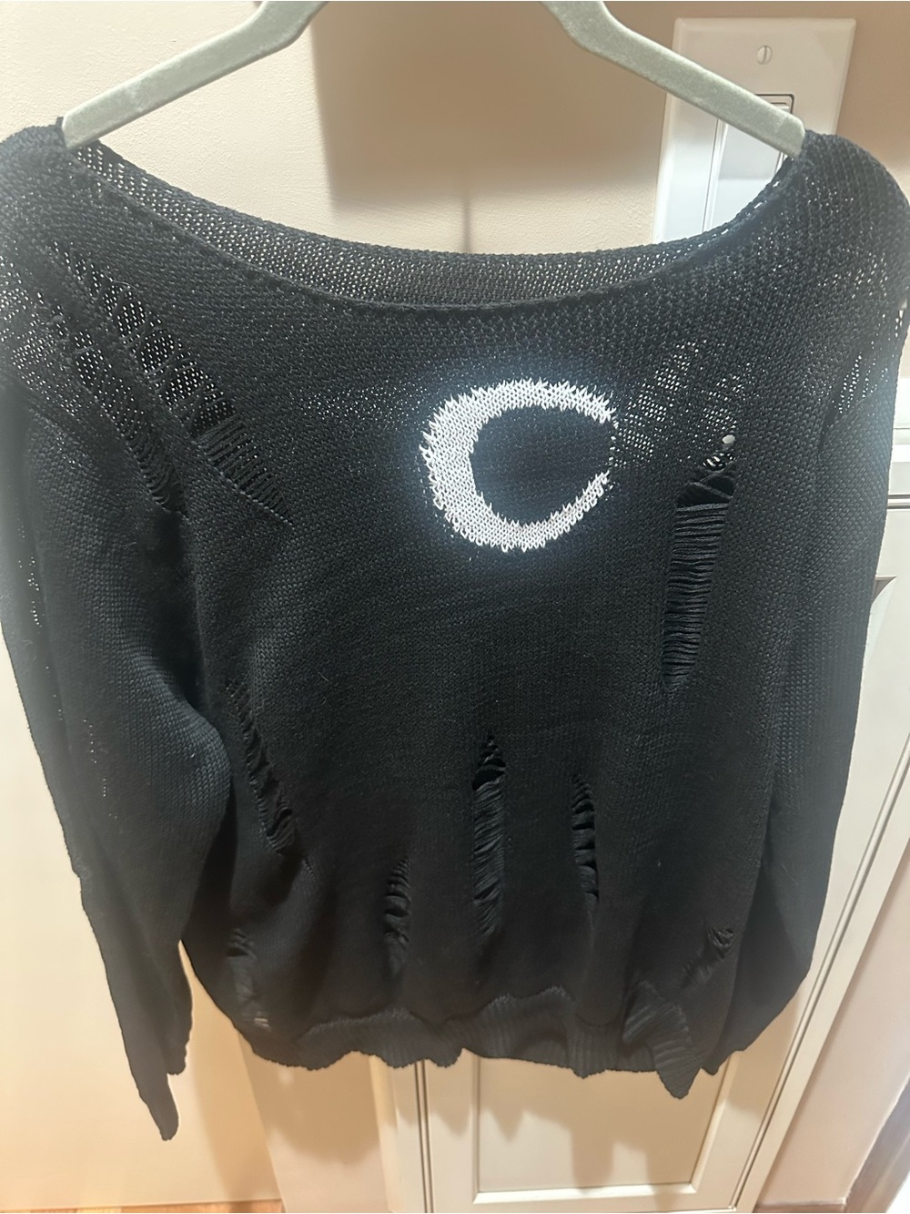 Black Distressed Women's Sweater with White Accent